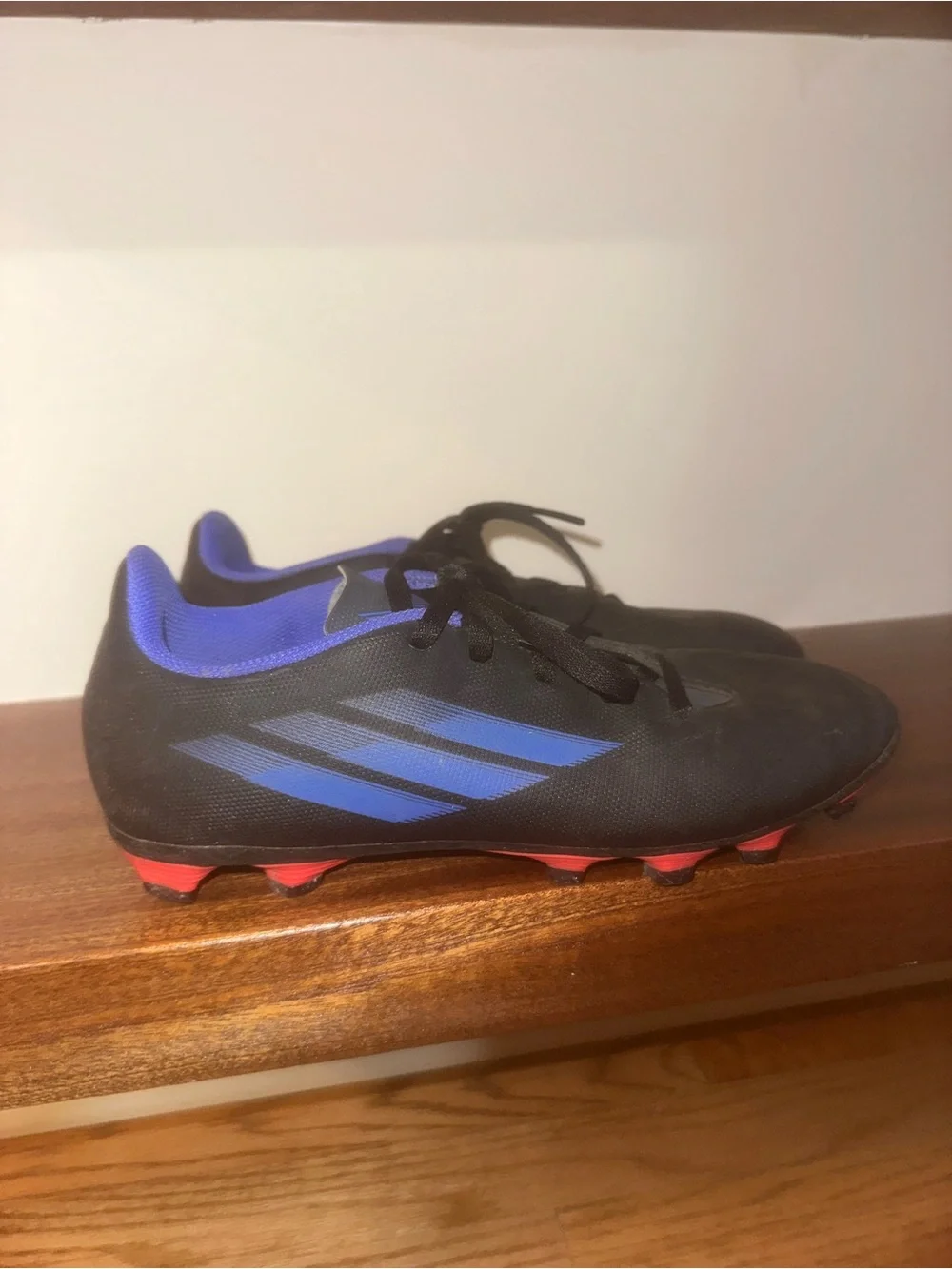 adidas Black Cleats with Blue Accents and Red Studs